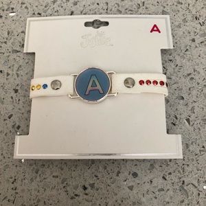 New! Justice white initial  wrap bracelet with an “A”
